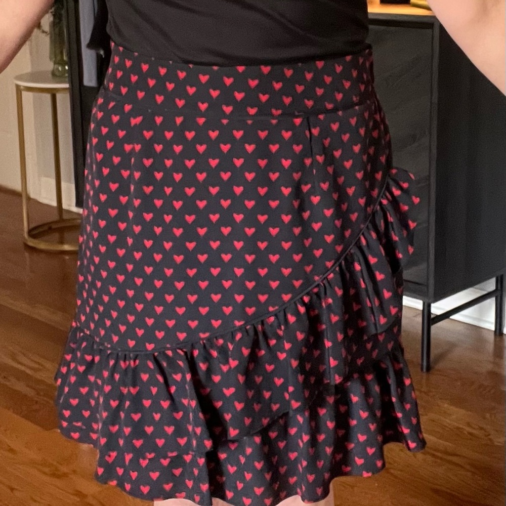 Cute black skirt with hearts and ruffle.